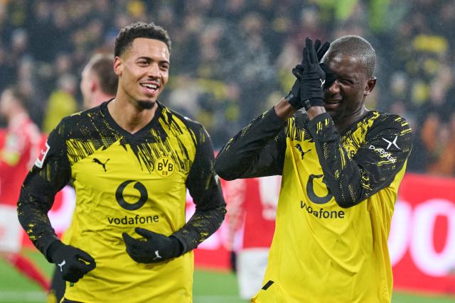 13 February 2026, North Rhine-Westphalia, Dortmund: Dortmund's Serhou Guirassy celebrates scoring his side's third goal with his teammate Felix Nmecha during the German Bundesliga soccer match between Borussia Dortmund and FSV Mainz 05 at Sgina Iduna Park. Photo: Bernd Thissen/dpa - IMPORTANT NOTE: In accordance with the regulations of the DFL German Football League and the DFB German Football Association, it is prohibited to utilize or have utilized photographs taken in the stadium and/or of the match in the form of sequential images and/or video-like photo series.