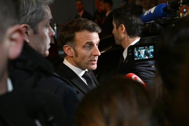 13 February 2026, Bavaria, Munich: French President Emmanuel Macron leaves Bayerischer Hof Hotel after the the 62nd Munich Security Conference. Photo: Felix Hörhager/dpa
