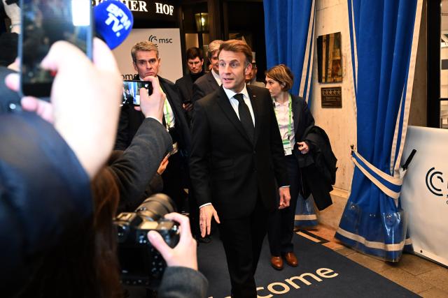 13 February 2026, Bavaria, Munich: French President Emmanuel Macron leaves Bayerischer Hof Hotel after the the 62nd Munich Security Conference. Photo: Felix Hörhager/dpa