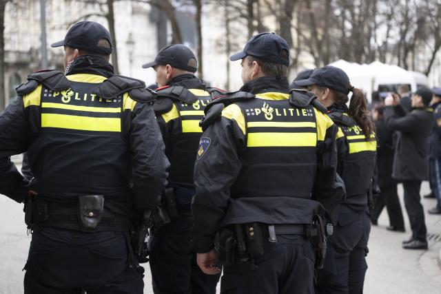 14 February 2026, Bavaria, Munich: Dutch police officers stand near the venue of the 62nd Munich Security Conference. Photo: Marijan Murat/dpa