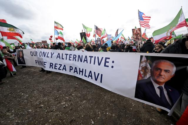 14 February 2026, Bavaria, Munich: "OUR ONLY ALTERNATIVE: PRINCE REZA PAHLAVI" is written on a banner at a demonstration on Theresienwiese under the slogan 'Human rights and freedom in Iran'. International solidarity with the Iranian people" on the sidelines of the Munich Security Conference, drawing attention to the human rights situation in Iran as part of wider protests calling for change in the country's political system. Photo: Felix Hörhager/dpa