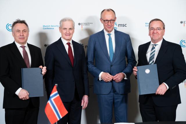 14 February 2026, Bavaria, Munich: (L-R) Tore O. Sandvik, Norway's Defence Minister, Jonas Gahr Store, Norway's Prime Minister, German Chancellor Friedrich Merz, and German Defence Minister Boris Pistorius attend a signing ceremony on the sidelines of the Munich Security Conference (MSC). Photo: Michael Bihlmayer/action press-Pool/dpa