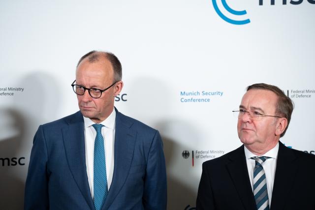14 February 2026, Bavaria, Munich: German Chancellor Friedrich Merz (L) and German Defence Secretary Boris Pistorius attend a signing ceremony on the sidelines of the Munich Security Conference (MSC). Photo: Michael Bihlmayer/action press-Pool/dpa