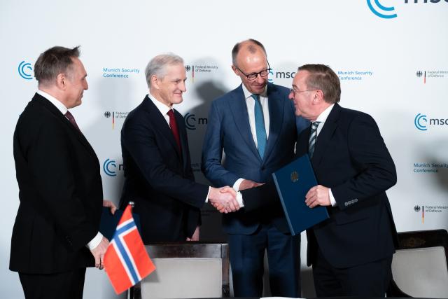 14 February 2026, Bavaria, Munich: (L-R) Tore O. Sandvik, Norway's Defence Minister, Jonas Gahr Store, Norway's Prime Minister, German Chancellor Friedrich Merz, and German Defence Minister Boris Pistorius attend a signing ceremony on the sidelines of the Munich Security Conference (MSC). Photo: Michael Bihlmayer/action press-Pool/dpa