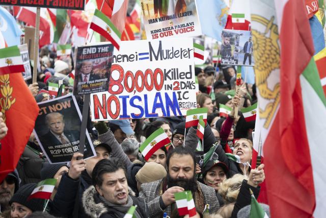 14 February 2026, Bavaria, Munich: Participants in a demonstration entitled 'Human Rights and Freedom in Iran'. International solidarity with the Iranian people" on the sidelines of the Munich Security Conference, drawing attention to the human rights situation in Iran as part of wider protests calling for change in the country's political system. Photo: Marijan Murat/dpa