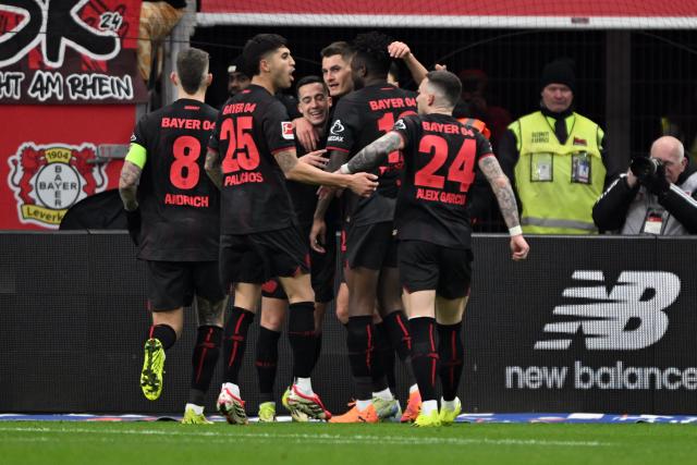 14 February 2026, North Rhine-Westphalia, Leverkusen: Leverkusen's players celebrate their side's second goal scored by Patrick Schick during the German Bundesliga soccer match between Bayer Leverkusen and FC St. Pauli at BayArena. Photo: Federico Gambarini/dpa - IMPORTANT NOTE: In accordance with the regulations of the DFL German Football League and the DFB German Football Association, it is prohibited to utilize or have utilized photographs taken in the stadium and/or of the match in the form of sequential images and/or video-like photo series.