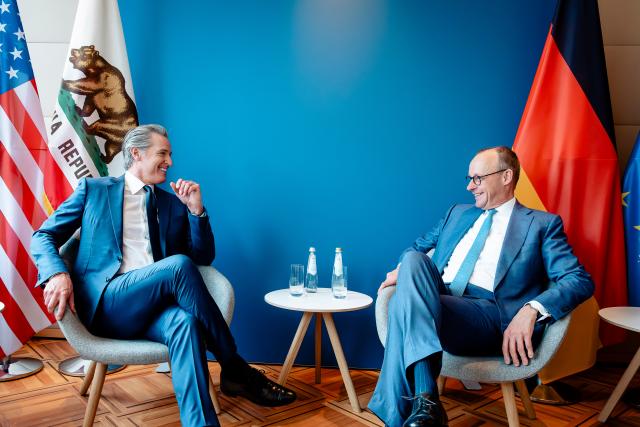 14 February 2026, Bavaria, Munich: German Chancellor Friedrich Merz (R) meets with Gavin Christopher Newsom, Governor of California on the sidelines of the 62nd Munich Security Conference (MSC). Photo: Steffen Kugler/dpa