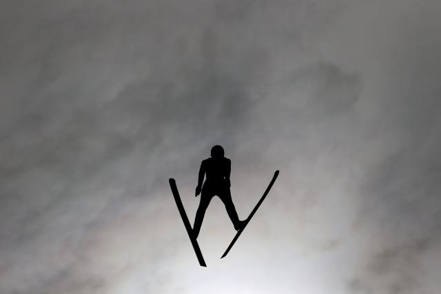 FILED - 04 March 2021, Bavaria, Oberstdorf: A Norwegian ski jumper competes in in a trial round of the men's large hill/10 km ski jumping at the FIS Nordic Ski World Championships. Action is needed to see if media reports about penis-related trickery to gain extra distance in ski jumping are true, the sport director of the German team said on Saturday. Photo: Daniel Karmann/dpa