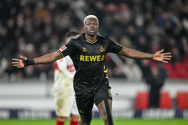14 February 2026, Baden-Württemberg, Stuttgart: Cologne's Ragnar Ache celebrates scoring his side's first goal during the German Bundesliga soccer match between VfB Stuttgart and 1. FC Cologne at MHPArena. Photo: Harry Langer/dpa - IMPORTANT NOTE: In accordance with the regulations of the DFL German Football League and the DFB German Football Association, it is prohibited to utilize or have utilized photographs taken in the stadium and/or of the match in the form of sequential images and/or video-like photo series.