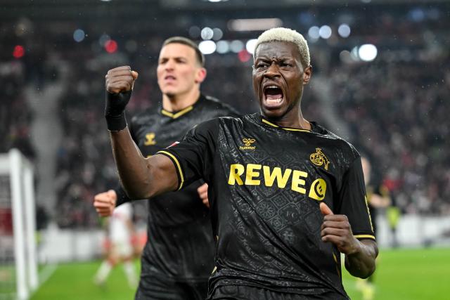 14 February 2026, Baden-Württemberg, Stuttgart: Cologne's Ragnar Ache celebrates scoring his side's first goal during the German Bundesliga soccer match between VfB Stuttgart and 1. FC Cologne at MHPArena. Photo: Harry Langer/dpa - IMPORTANT NOTE: In accordance with the regulations of the DFL German Football League and the DFB German Football Association, it is prohibited to utilize or have utilized photographs taken in the stadium and/or of the match in the form of sequential images and/or video-like photo series.