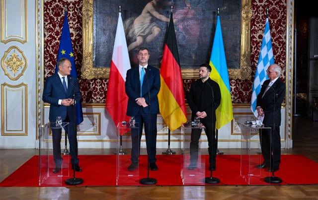 14 February 2026, Bavaria, Munich: (L-R) Donald Tusk, Prime Minister of Poland, Markus Soeder, Prime Minister of Bavaria, Volodymyr Zelensky, President of Ukraine, and Wolfgang Ischinger, Head of the Munich Security Conference, are pictured before the presentation of the Ewald von Kleist Prize, which is awarded this year to the Ukrainian people. Photo: Sven Hoppe/dpa