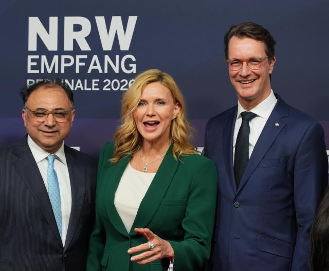 29 January 2026, Berlin: Walid Nakschbandi (l), Managing Director of the Film und Medienstiftung NRW, actress Veronica Ferres (C) and Hendrik Wuest, Minister President of North Rhine-Westphalia, stand next to each other at the reception in the North Rhine-Westphalia State Representation during the 76th Berlin International Film Festival. Photo: Soeren Stache/dpa