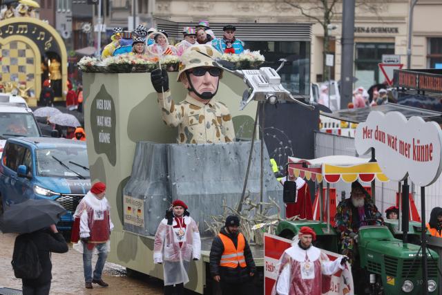 16 February 2026, North Rhine-Westphalia, Cologne: A float that deals with the topic of drone defense takes part in the Rose Monday parade in Cologne. Rose Monday on the Rhine is the highlight of the Rhineland carnival season with its traditional parades. Photo: Oliver Berg/dpa