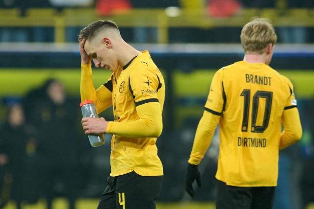 FILED - 28 January 2026, North Rhine-Westphalia, Dortmund: Borussia Dortmund's Nico Schlotterbeck (L) and Julian Brandt react after the UEFA Champions League soccer match between Borussia Dortmund and Inter Milan at Signal Iduna Park. Photo: Bernd Thissen/dpa