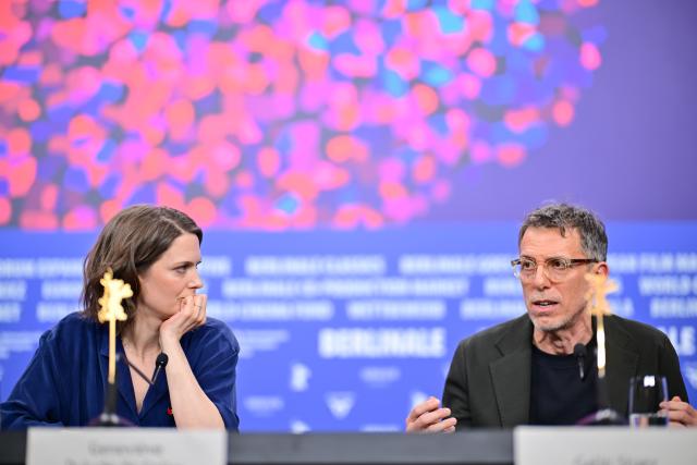 16 February 2026, Berlin: Bulgarian actor Galin Stoev (R) and Canadian director and screenwriter Genevieve Dulude-de Celles speak at a press conference for the film "Nina Roza" during the 76th Berlin International Film Festival. Photo: Sebastian Christoph Gollnow/dpa