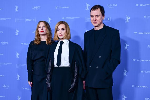 16 February 2026, Berlin: (L-R) Austrian actress Birgit Minichmayr, French actress Isabelle Huppert and German actor Lars Eidinger stand on the red carpet during the premiere of the film "Die Blutgräfin" (The Blood Countess) during the 76th Berlin International Film Festival. Photo: Sebastian Christoph Gollnow/dpa
