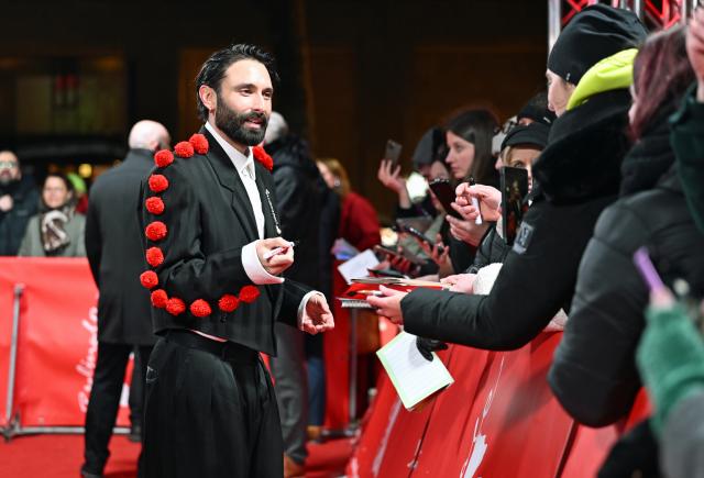 16 February 2026, Berlin: Austrian singer Tom Neuwirth, alias Conchita Wurst, signs autographs for fans at the premiere of the film "Die Blutgräfin" (The Blood Countess) during the 76th Berlin International Film Festival. Photo: Elisa Schu/dpa