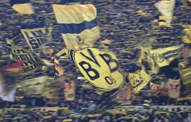 17 February 2026, North Rhine-Westphalia, Dortmund: Dortmund fans cheer in the stands during the UEFA Champions League intermediate round first leg soccer match between Borussia Dortmund and Atalanta Bergamo at the Signal Iduna Park. Photo: Bernd Thissen/dpa