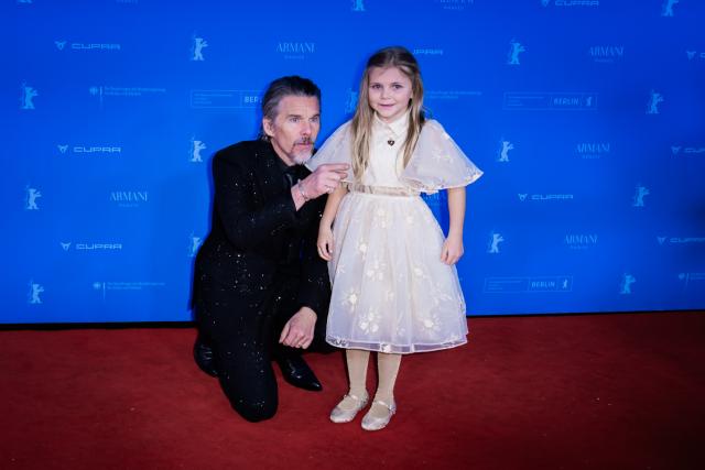 17 February 2026, Berlin: US actor Ethan Hawke and British actress Avy Berry walk the red carpet at the Zoopalast cinema for the premiere of the film "The Weight" during the premiere of the film "The Weight" during the 76th Berlin International Film Festival. Photo: Christoph Soeder/dpa
