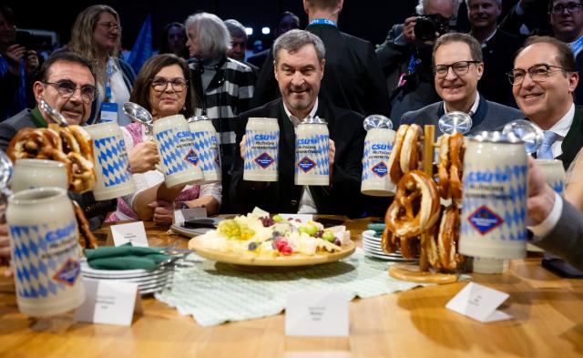 18 February 2026, Bavaria, Passau: (L-R) Klaus Holetschek, Chairman of the Christian Social Union (CSU) parliamentary group in the state parliament, Ilse Aigner, President of the Bavarian state parliament, Markus Soeder, Minister President of Bavaria and CSU leader, Martin Huber, Secretary General of the CSU, and Alexander Dobrindt, German Minister of the Interior attend the CSU's political Ash Wednesday. Photo: Sven Hoppe/dpa