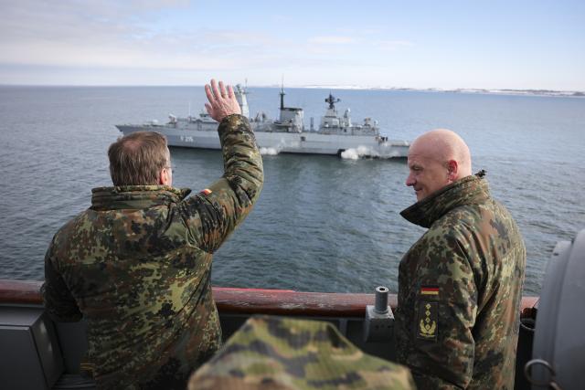18 February 2026, Schleswig-Holstein, Putlos: Boris Pistorius (L), German Minister of Defense, waves to the crew of the German Navy frigate Brandenburg, alongside Nato General Ingo Gerhartz, Commander Allied Joint Force Command Brunssum, on board the Spanish landing ship "L52 Castilla" at a media event for the Nato manoeuvre "Steadfast Dart 26" in the Baltic Sea off the Putlos military training area. Photo: Christian Charisius/dpa-Pool/dpa
