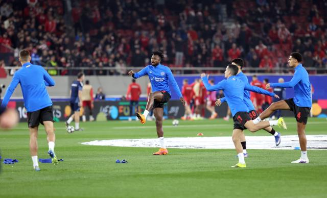 18 February 2026, Piräus: Bayer 04 Leverkusen players warm up on the pitch ahead of their UEFA Champions League soccer match between Olympiacos F.C. and Bayer 04 Leverkusen at Georgios Karaiskakis Stadium. Photo: Yorgos Karahalis/dpa
