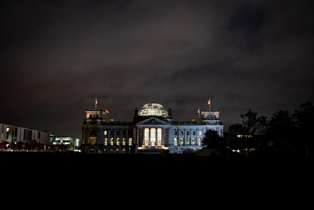 FILED - 06 October 2025, Berlin: The windows of the Reichstag building, home to the German Bundestag, are lit up in Berlin early in the morning. Photo: Fabian Sommer/dpa