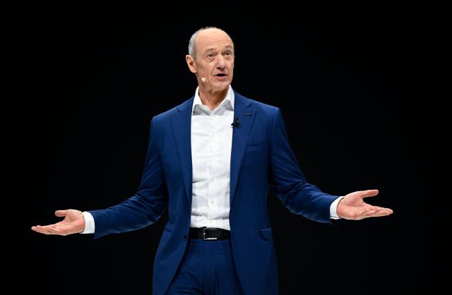 12 February 2026, Bavaria, Munich: Roland Busch, CEO of Siemens AG, stands on the stage in the Olympiahalle during the Annual Shareholders' Meeting of Siemens AG. Photo: Sven Hoppe/dpa