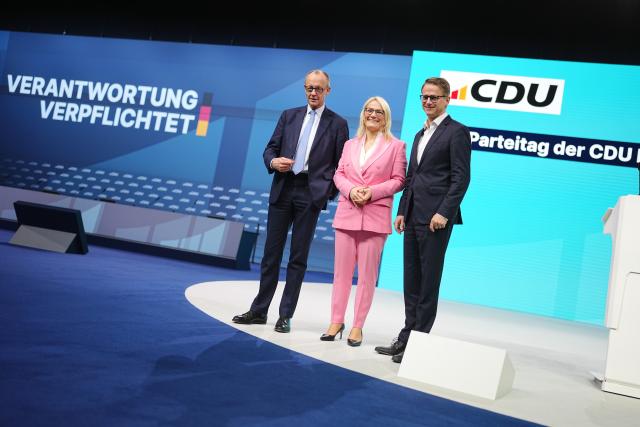 19 February 2026, Baden-Württemberg, Stuttgart: (L-R)German Chancellor Friedrich Merz, Christina Stumpp, Deputy CDU General Secretary, together with Carsten Linnemann, CDU General Secretary, take part in the tour of the hall before the CDU federal party conference. On Friday, the presidium and executive committee will be newly elected. For the third time in a row, Merz will be the only candidate for the chairmanship. Photo: Kay Nietfeld/dpa
