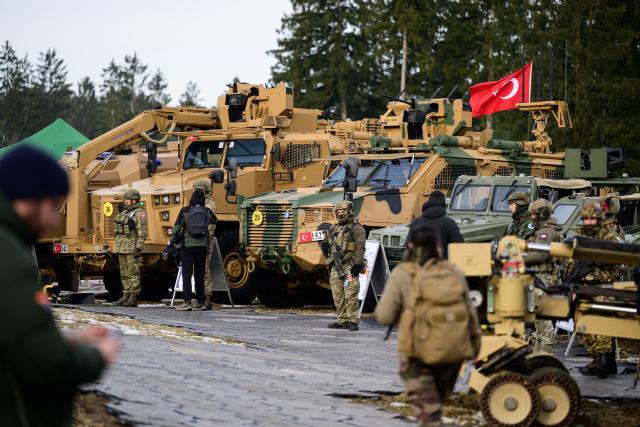 19 February 2026, Lower Saxony, Bergen: Turkish soldiers show off some of their equipment during a NATO exercise in Bergen. NATO's largest multinational exercise of the year began on January 15. According to the Bundeswehr, Germany is both the "hub" and host nation in the first quarter. Photo: Philipp Schulze/dpa