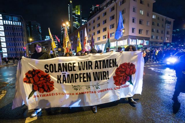 19 February 2026, Hesse, Frankfurt/Main: Demonstrators march through downtown Frankfurt under the slogan "Anti-Racism Day" on the anniversary of the racist attacks in Hanau. Photo: Boris Roessler/dpa