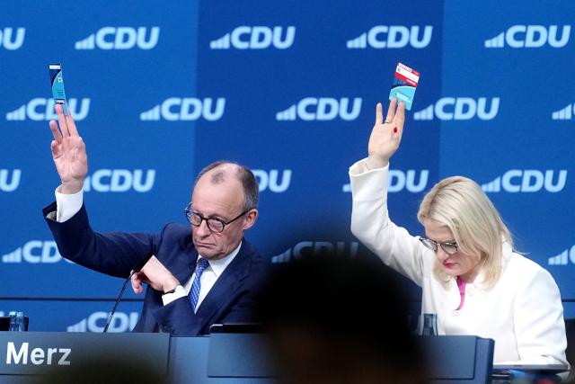 20 February 2026, Baden-Wuerttemberg, Stuttgart: German Chancellor Friedrich Merz, CDU party chairman, and Chrisitna Stumpp, deputy CDU general secretary, take part in the CDU federal party conference. The CDU elects its new leadership bodies. Chancellor Merz is the only candidate for the chairmanship for the third time in a row. Photo: Kay Nietfeld/dpa
