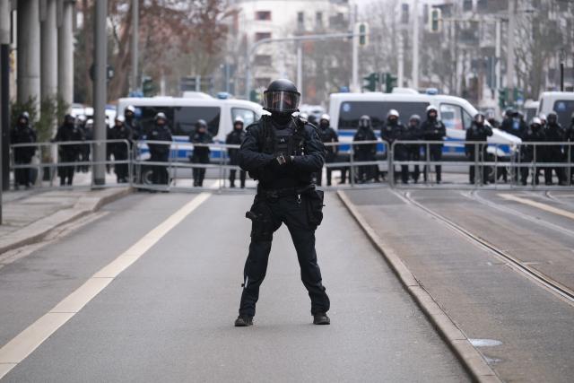 FILED - 14 February 2026, Saxony, Dresden: Police officers cordon off a street as a broad coalition protests against a planned neo-Nazi march marking the anniversary of the bombing of Dresden. Photo: Sebastian Willnow/dpa