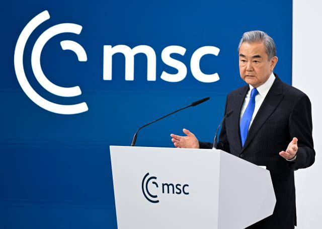 FILED - 14 February 2026, Bavaria, Munich: Chinese Foreign Minister Wang Yi speaks at the 62nd Munich Security Conference. Photo: Sven Hoppe/dpa