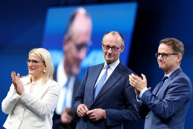 20 February 2026, Baden-Württemberg, Stuttgart: (L-R) Christina Stumpp, Deputy General Secretary of the CDU, Federal Chancellor Friedrich Merz, CDU Party Chairman, and CDU General Secretary Carsten Linnemann stand on the stage after Merz's speech at the CDU Federal Party Conference. The CDU elects its new leadership bodies. For the third time in a row, Chancellor Merz is the only candidate for the chairmanship. Photo: Kay Nietfeld/dpa