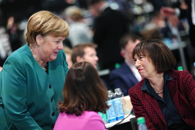 20 February 2026, Baden-Wuerttemberg, Stuttgart: Former German Chancellor Angela Merkel (L) talks to Charlotte Merz (R), wife of German Chancellor Friedrich Merz, at the Christian Democratic Union of Germany (CDU) federal party conference. Photo: Kay Nietfeld/dpa
