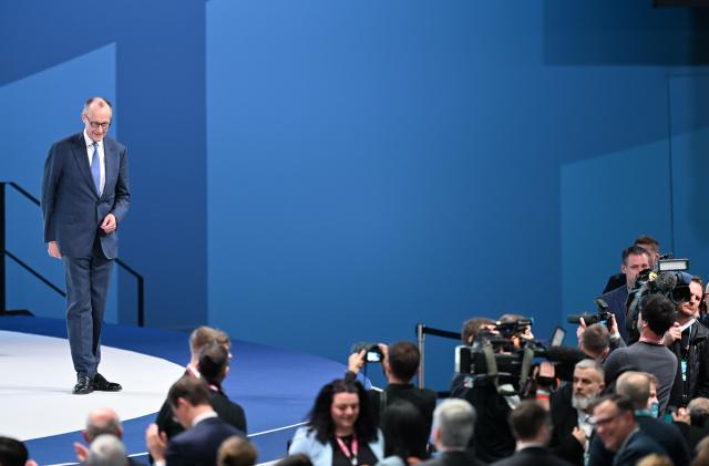20 February 2026, Baden-Wuerttemberg, Stuttgart: German Chancellor and Christian Democratic Union of Germany (CDU) party leader Friedrich Merz stands on stage after his speech at the CDU federal party conference. Photo: Katharina Kausche/dpa
