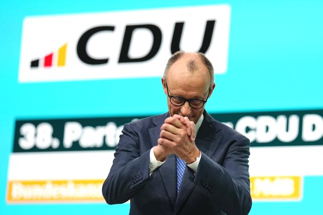 20 February 2026, Baden-Wuerttemberg, Stuttgart: German Chancellor and Christian Democratic Union of Germany (CDU) party leader Friedrich Merz waves to delegates after his speech at the CDU federal party conference. Photo: Kay Nietfeld/dpa