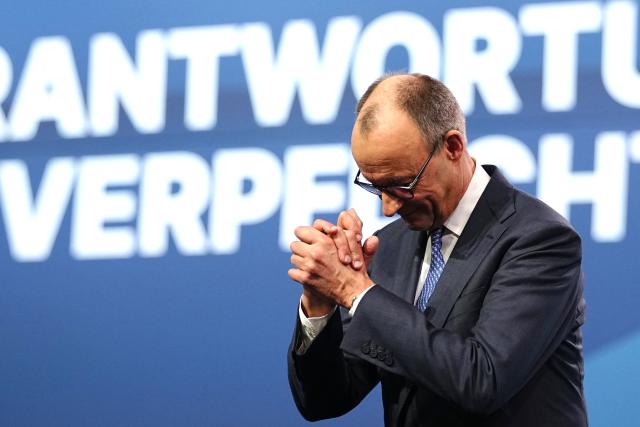 20 February 2026, Baden-Wuerttemberg, Stuttgart: German Chancellor and Christian Democratic Union of Germany (CDU) party leader Friedrich Merz waves to delegates after his speech at the CDU federal party conference. Photo: Kay Nietfeld/dpa