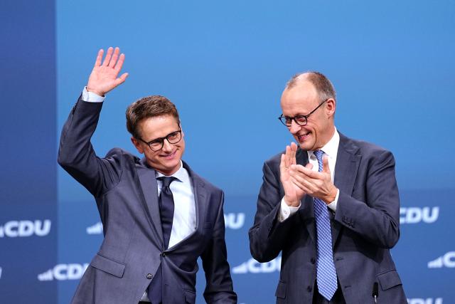 20 February 2026, Baden-Wuerttemberg, Stuttgart: German Chancellor and Christian Democratic Union of Germany (CDU) party leader Friedrich Merz applauds CDU secretary general Carsten Linnemann after his discharge speech at the CDU federal party conference. Photo: Kay Nietfeld/dpa