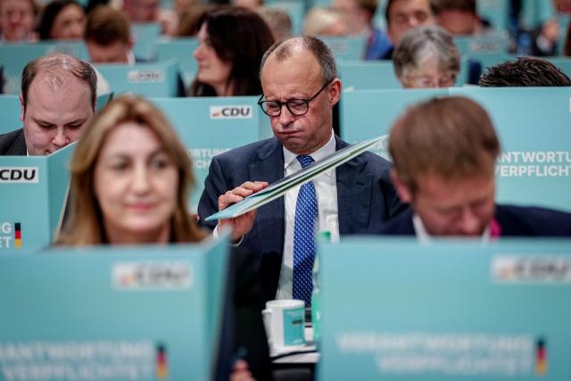 20 February 2026, Baden-Wuerttemberg, Stuttgart: German Chancellor and Christian Democratic Union of Germany (CDU) party leader Friedrich Merz waits for the election of the federal chairman at the CDU federal party conference. Photo: Kay Nietfeld/dpa