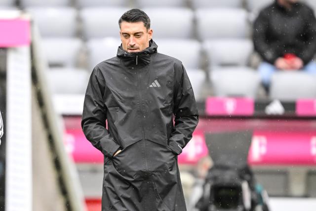 21 February 2026, Bavaria, Munich: Coach Albert Riera of Eintracht Frankfurt stands in the stadium before the German Bundesliga Match between Bayern Munich and Eintracht Frankfurt at the Allianz Arena. Photo: Harry Langer/dpa - IMPORTANT NOTE: In accordance with the regulations of the DFL German Football League and the DFB German Football Association, it is prohibited to utilize or have utilized photographs taken in the stadium and/or of the match in the form of sequential images and/or video-like photo series.