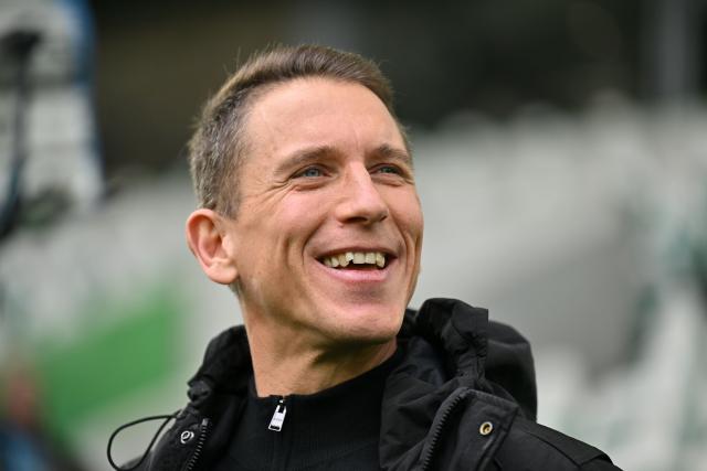 21 February 2026, Lower Saxony, Wolfsburg: Coach Daniel Bauer of VfL Wolfsburg stands in the stadium before the German Bundesliga Match between VfL Wolfsburg and FC Augsburg at the Volkswagen Arena. Photo: Swen Pförtner/dpa - IMPORTANT NOTE: In accordance with the regulations of the DFL German Football League and the DFB German Football Association, it is prohibited to utilize or have utilized photographs taken in the stadium and/or of the match in the form of sequential images and/or video-like photo series.