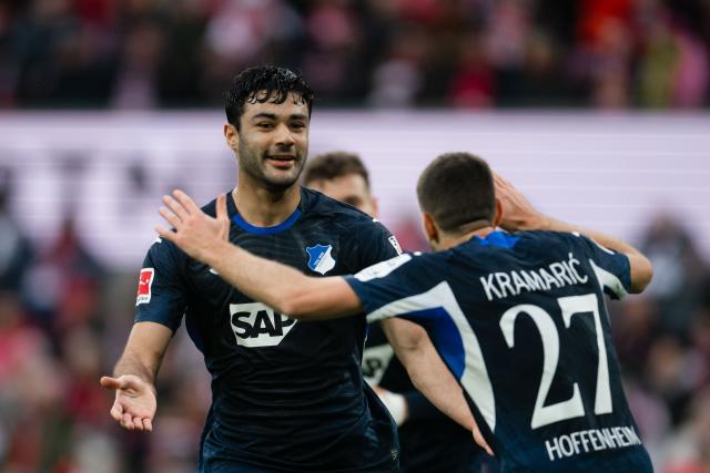 21 February 2026, North Rhine-Westphalia, Cologne: Hoffenheim's scorers Ozan Kabak (L) celebrate scoring his side's first goal with teammate Andrej Kramaric during the German Bundesliga soccer match between 1. FC Cologne and TSG 1899 Hoffenheim at RheinEnergieStadion. Photo: Marius Becker/dpa - WICHTIGER HINWEIS: Gemäß den Vorgaben der DFL Deutsche Fußball Liga bzw. des DFB Deutscher Fußball-Bund ist es untersagt, in dem Stadion und/oder vom Spiel angefertigte Fotoaufnahmen in Form von Sequenzbildern und/oder videoähnlichen Fotostrecken zu verwerten bzw. verwerten zu lassen.