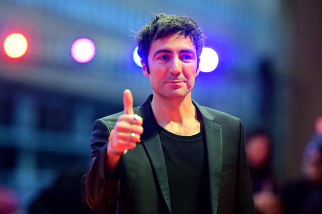 21 February 2026, Berlin: German director Ilker Catak stands on the red carpet in front of the Berlinale Palast upon arrival at the Berlinale awards ceremony during the 76th Berlin International Film Festival. Photo: Sebastian Christoph Gollnow/dpa