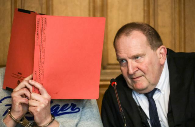 23 February 2026, Bremen: One of the defendants sits next to his lawyer Thomas Domanski at Bremen Regional Court. A 19-year-old and a 35-year-old have been charged with conspiring to carry out a jihadist-motivated attack on a hospital in Bremerhaven in the summer of 2025. Photo: Focke Strangmann/dpa