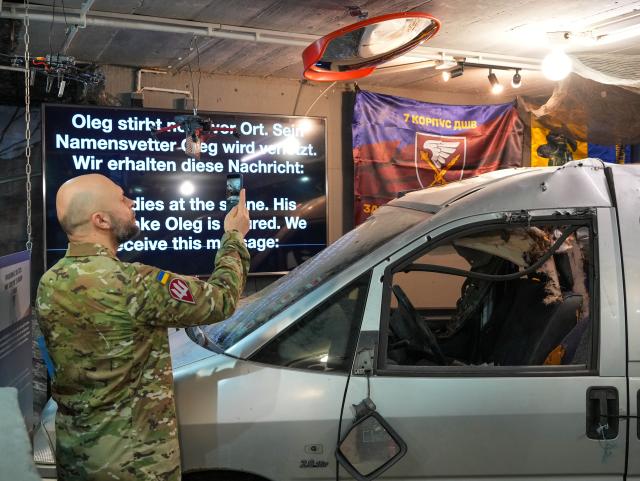 23 February 2026, Berlin: Volodymyr Polevyi, a colonel in the Ukrainian armed forces, films during the press conference for the opening of the Ukraine Museum in the Berlin Story Bunker. The museum claims to be the first of its kind in the world and displays the largest collection of war artifacts from the country outside of Ukraine. Photo: Soeren Stache/dpa