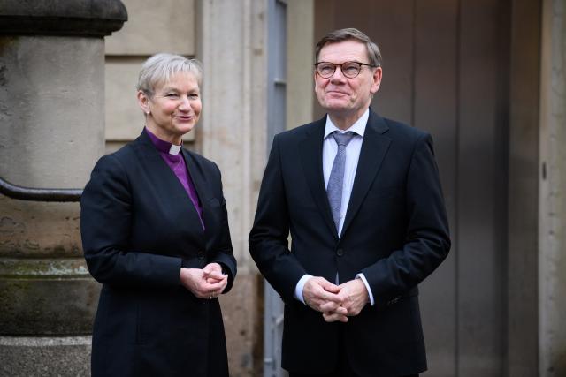 24 February 2026, Berlin: Kirsten Fehrs, Chair of the Council of the Evangelical Church in Germany (EKD), and Johann Wadephul, German Foreign Minister, stand in front of the French Friedrichstadtkirche at Gendarmenmarkt before the Ecumenical Prayer for Peace on the fourth anniversary of the Russian-Ukraine war. Photo: Bernd von Jutrczenka/dpa