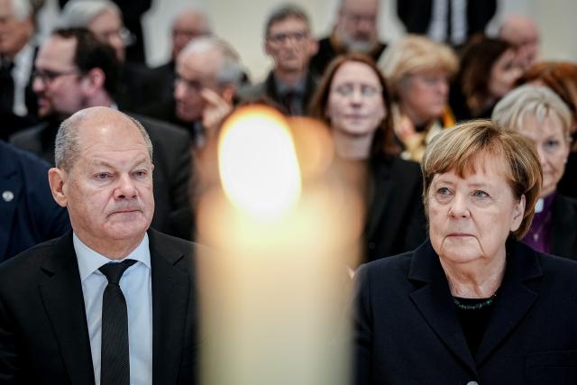 24 February 2026, Berlin: Olaf Scholz, former German Chancellor, and Angela Merkel , former German Chancellor, take part in the act of mourning for the late former Federal Minister for Family Affairs and long-time President of the Bundestag Rita Suessmuth (CDU) with an ecumenical service in St. Hedwig's Cathedral. Rita Suessmuth died on 01.02.2026 at the age of 88. Photo: Kay Nietfeld/dpa