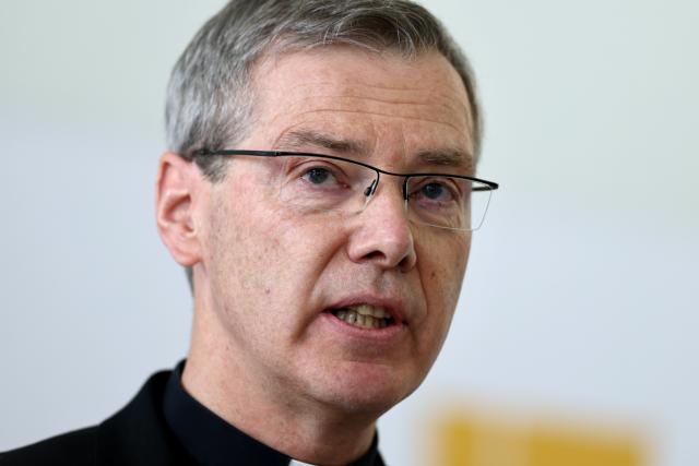 24 February 2026, Bavaria, Wuerzburg: Bishop Heiner Wilmer, new Chairman of the German Bishops' Conference, speaks at a press conference following his election. Photo: Daniel Löb/dpa
